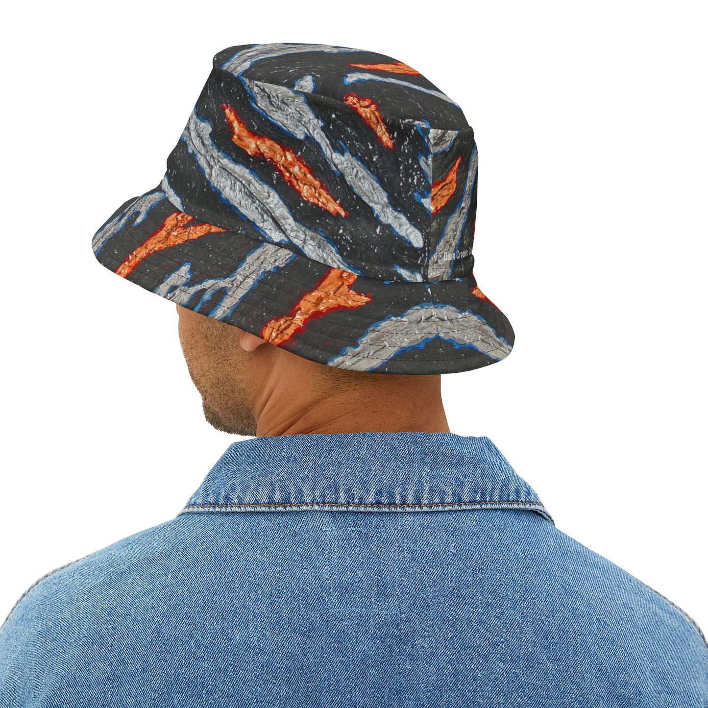Bucket Hat metallic slashes — a bold design with slashes of gold and silver on a bed of black. Strong streetwear for a bold outfit
