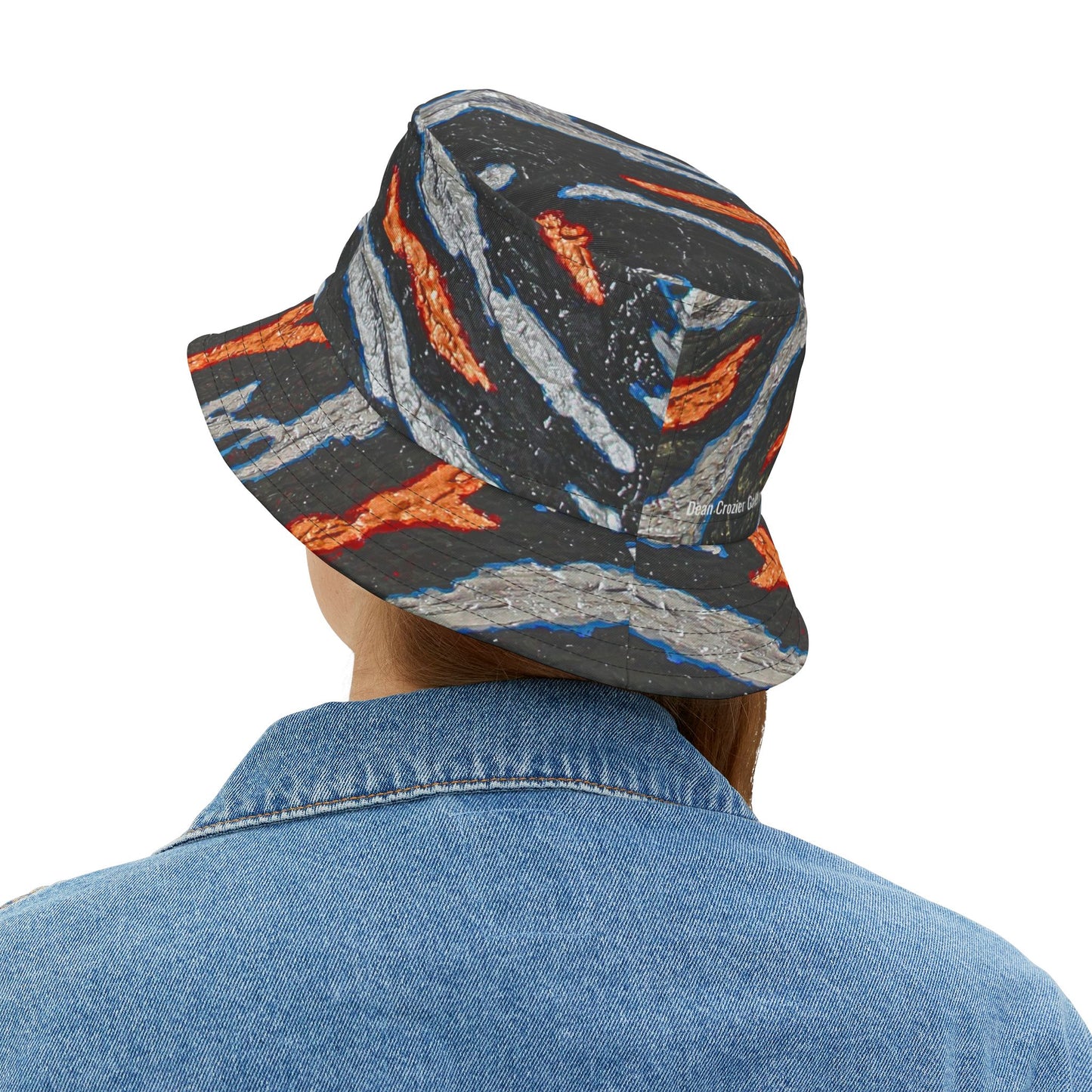 Bucket Hat metallic slashes — a bold design with slashes of gold and silver on a bed of black. Strong streetwear for a bold outfit