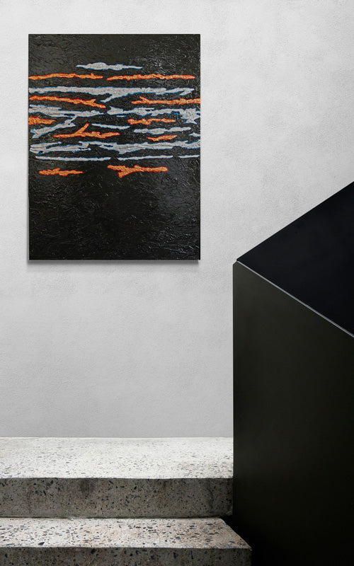SEAM precious metals cross through a darkened background across a heavy, bold canvas.